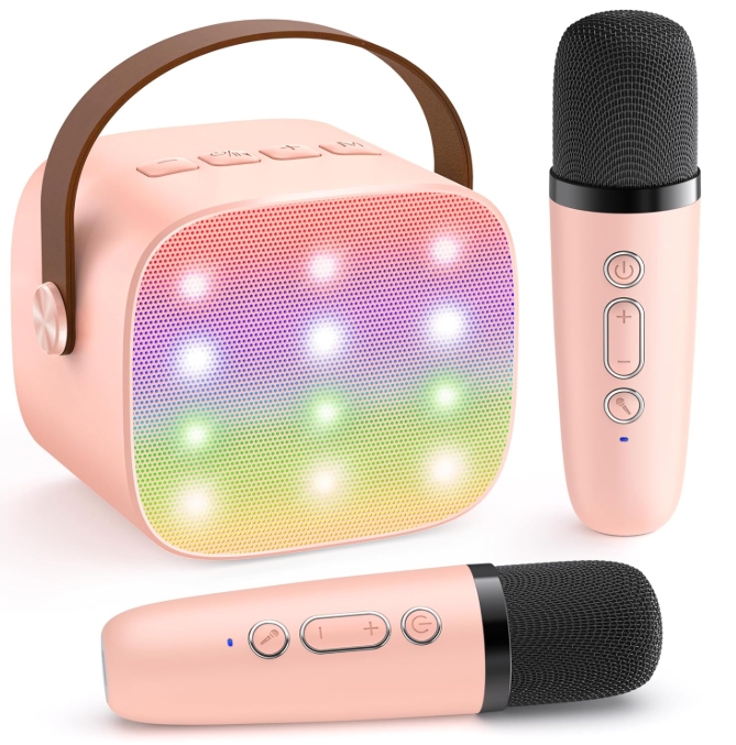 Mini Karaoke Machine on a living room table next to iphone for size comparison